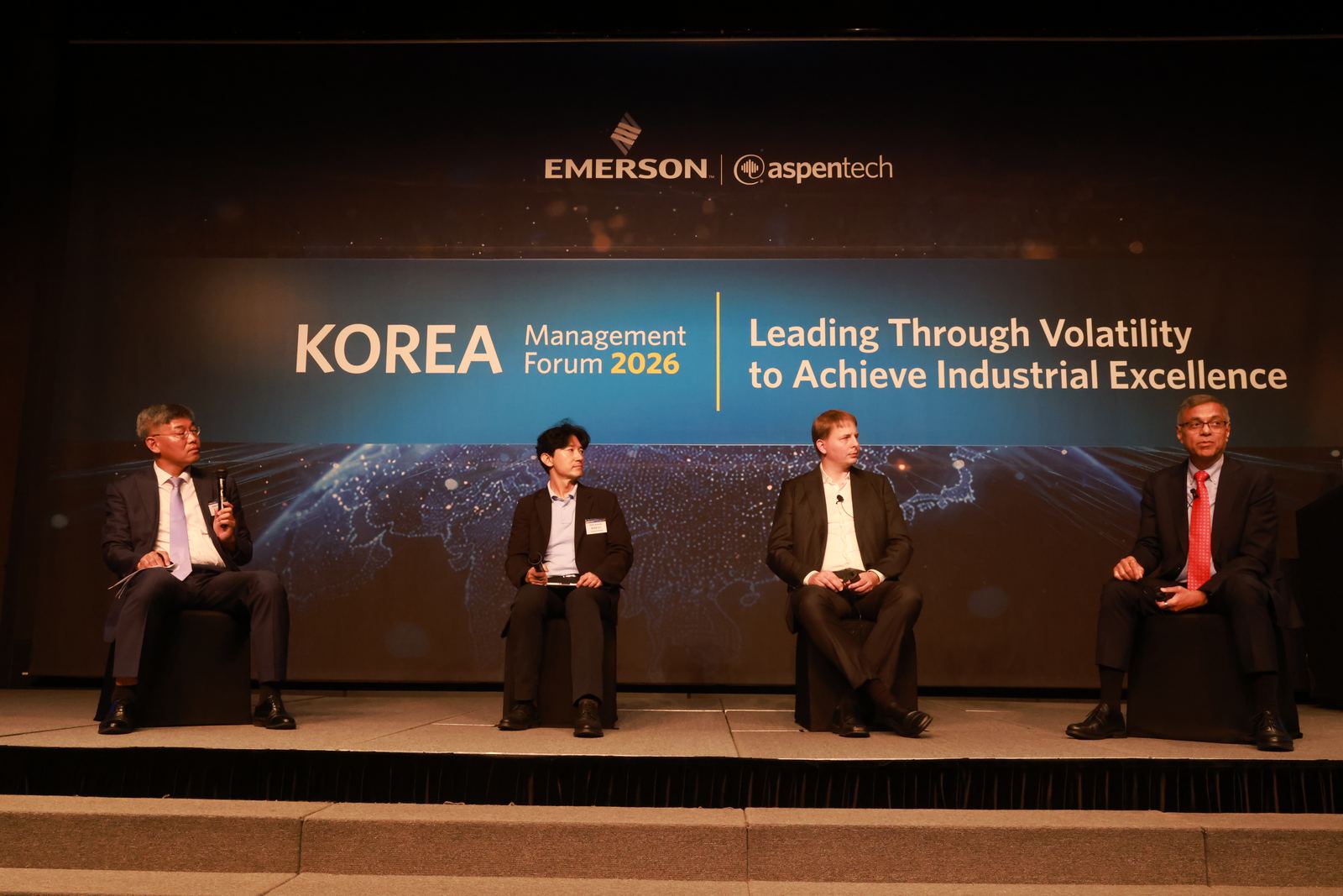 Four panelists seated on stage in front of the Korea Management Forum 2026 banner